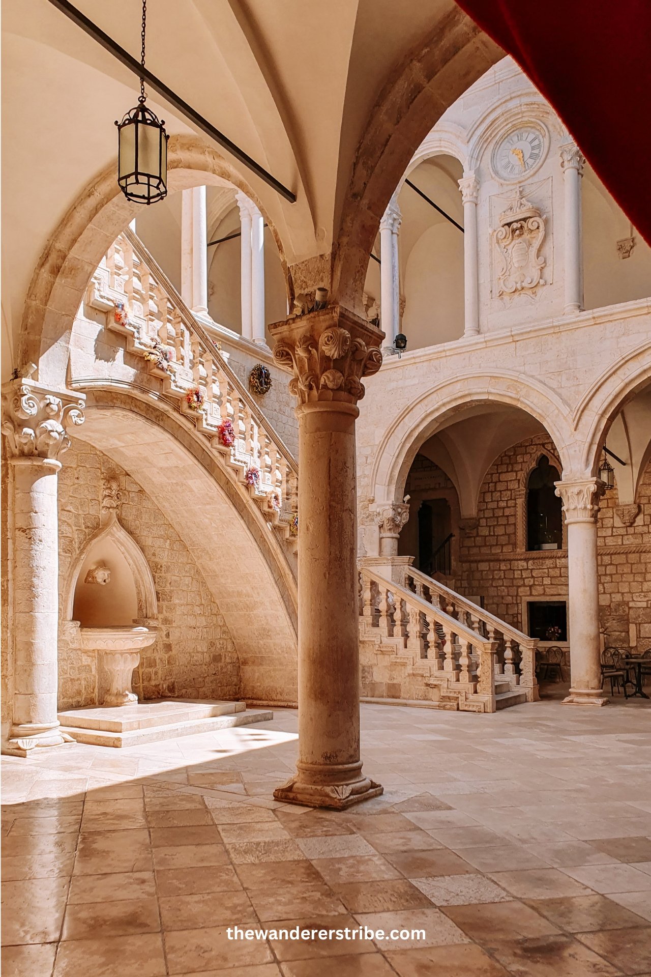 Stone archways and Gothic architecture of the Rector’s Palace in Dubrovnik.