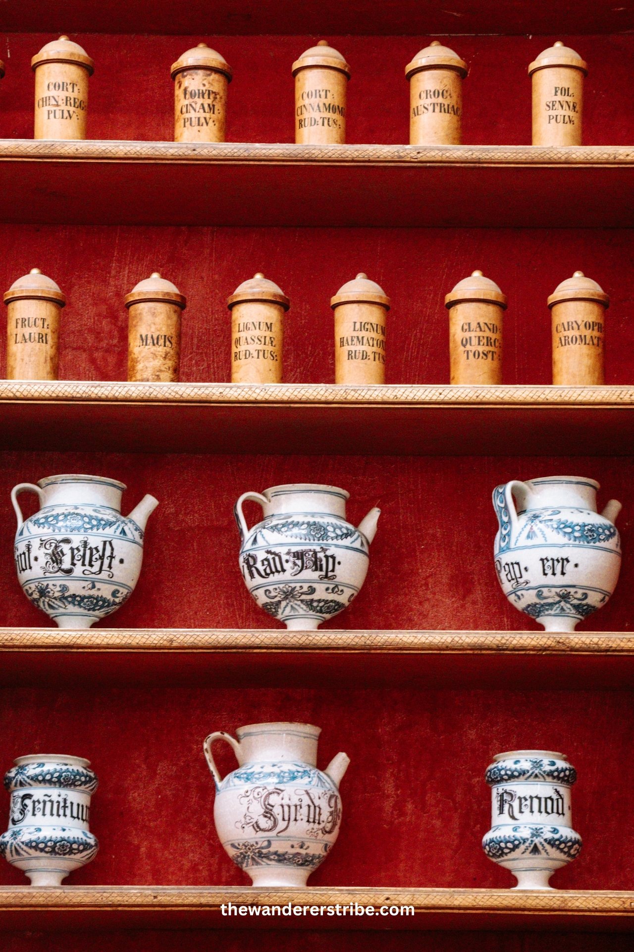 Rows of antique apothecary jars and ceramic pots displayed in Dubrovnik’s historic Franciscan Monastery Pharmacy.